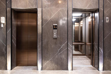 Elevator Doors, transoms, door jambs and return walls in Fused Metal in custom