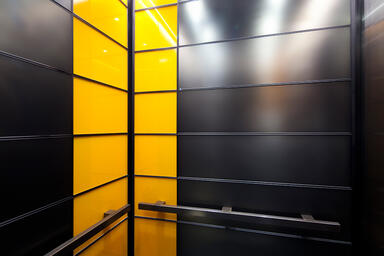LEVELe-103A Elevator Interior; Capture panels in ViviChrome Chromis glass 