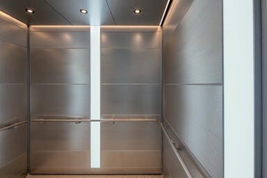 LEVELe-107 Elevator Interior with Capture panels in Stainless Steel with Sandsto