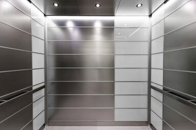 LEVELe-103A Elevator Interior; Capture panels in Stainless Steel with Seastone 