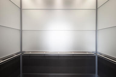 LEVELe-104 Elevator Interior with Capture panels in ViviChrome Chromis glass 