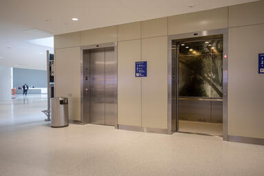Elevator interior panels with ViviSpectra Spectrum glass in Reflect configuratio