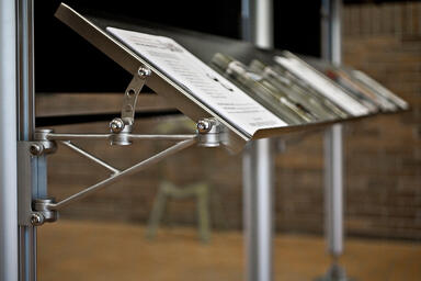 Profile One Information Kiosk: custom shelves and stainless steel support arm 