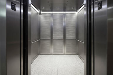 LEVELc-2000N Elevator Interior with inset panels in Stainless Steel