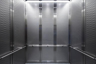 LEVELc-2000 Elevator Interior with inset panels in Stainless Steel 