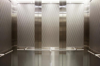 LEVELc-2000 Elevator Interior with upper inset panels in Stainless Steel 