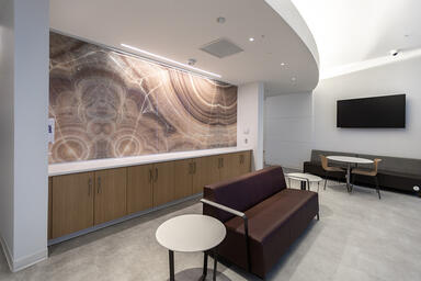 Wall panels in ViviStone Cream Onyx glass with custom interlayer and Standard