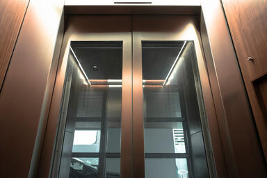 Elevator doors in Fused White Gold with Seastone finish at Private Residence, T.