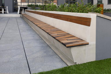 Boardwalk Bench in custom 34-foot length with FSC® Recycled 100% Cumaru hardwood