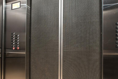 Elevator doors shown in Bonded Nickel Silver with Dark patina