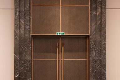 Door and transom panels in Bonded Bronze with Dark Patina and Dash pattern