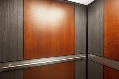 LEVELe-105E Elevator Interior; panels in Bonded Aluminum with Dark Patina 