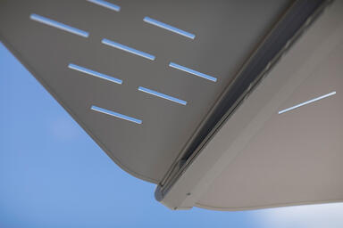 Detail of Soleris Sunshade aluminum panels shown with Slat perforation pattern