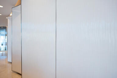 Wall panels in Bonded Quartz, White, with Kalahari pattern at Saraya Twin Towers