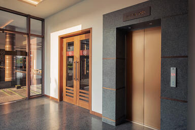Elevator doors in Fused Bronze with Seastone finish at Sheraton Grand Chen