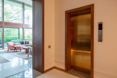 Elevator doors in custom Fused Metal color with Satin finish at Private