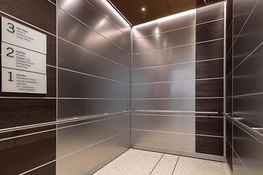 LEVELe-103 Elevator Interior with Capture panels in Stainless Steel with Linen
