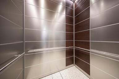 LEVELe-103 Elevator Interior with Capture panels in Stainless Steel with Linen