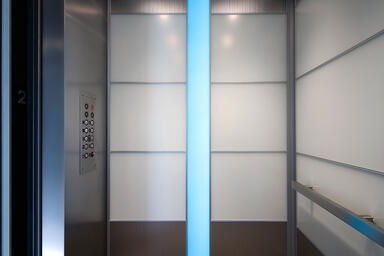 LEVELe-107 Elevator Interior with Capture panels in ViviChrome Chromis glass 