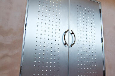 Doors shown in Stainless Steel with Sandstone finish and Circle Impression