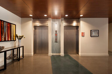 Elevator doors and transoms shown in Stainless Steel with Seastone finish