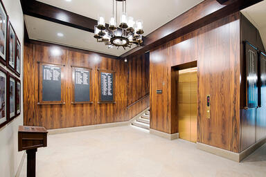Elevator doors shown in Fused Bronze with Satin finish