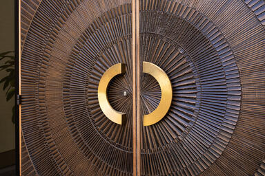 Bonded Metal Doors in Bonded Bronze with Dark Patina and Solstice pattern; Ara