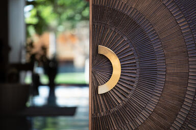 Bonded Metal Door in Bonded Bronze with Dark Patina and Solstice pattern; Ara