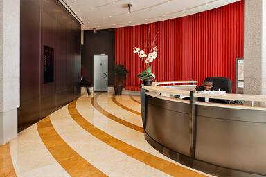 Reception desk and LEVELe Wall Cladding System, Float panels in Fused Nickel