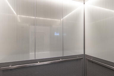 LEVELe-105 elevator interior with customized panel layout; Capture panels