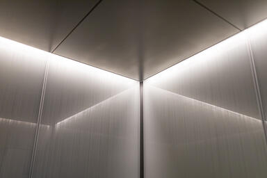 LEVELe-105 elevator interior with customized panel layout; Capture panels
