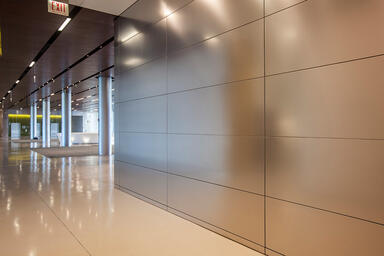LEVELe Wall Cladding System with Float panels and custom panels in Stainless 