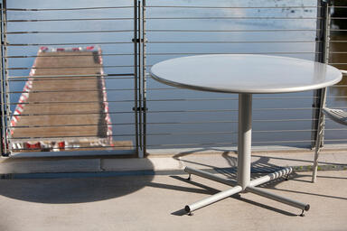 Cross Table, 42&quot; round table top and 36&quot; base, shown with Bright Silver Gloss 