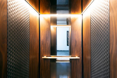 LEVELe-105 Elevator Interior with customized panel layout; Minimal panels in Ame
