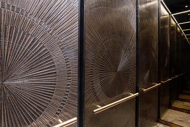 LEVELe-105 Elevator Interior with customized panel layout: panels in Bonded