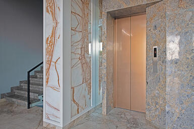 Elevator Doors, transoms, door jambs and return walls in Fused Metal in custom