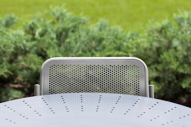 Detail of Column Table shown with perforated table top in Stainless Steel 