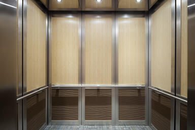 LEVELc-2000 Elevator Interior with upper panels in custom Bamboo wood veneer