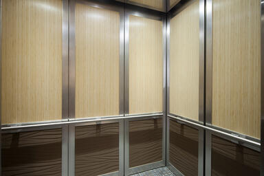 LEVELc-2000 Elevator Interior with upper panels in custom Bamboo wood veneer