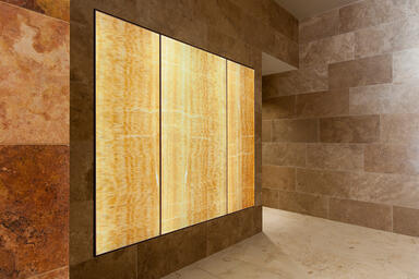 LightPlane Panels in ViviStone Honey Onyx with Pearlex+ finish shown illuminated 