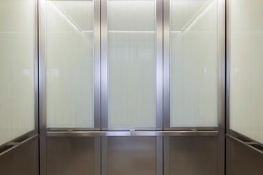 LEVELc-2000N Elevator Interiors with panels in ViviGraphix Graphica glass