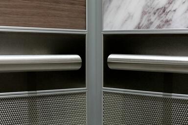 Round handrails shown in LEVELe-104A Elevator Interior; Capture panels in