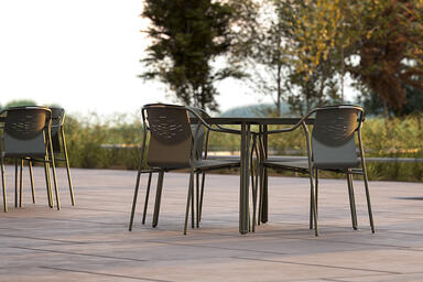 Factor Chairs without arms shown with formed aluminum seat in Moss Texture powde