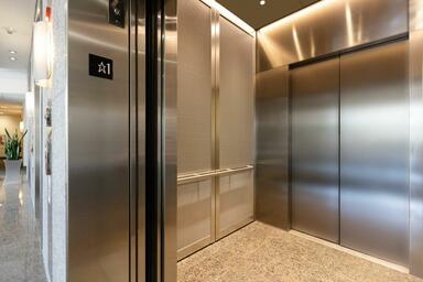 LEVELc-2000 Elevator Interior with customized panel layout; upper panels in Bond