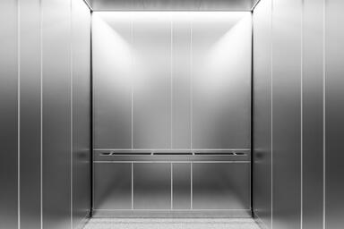 LEVELe-101A Elevator Interior; Capture panels in Stainless Steel with Seastone f