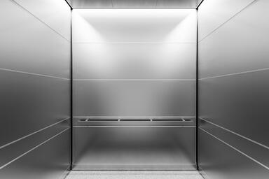 LEVELe-104A Elevator Interior; Capture panels in Stainless Steel with Seastone f