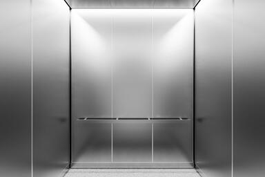LEVELe-105B Elevator Interior; Capture panels in Stainless Steel with Seastone f