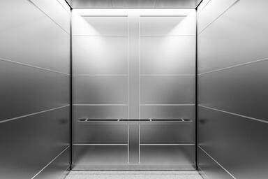 LEVELe-107A Elevator Interior; Capture panels in Stainless Steel with Seastone f