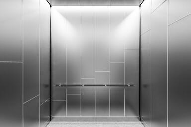LEVELe-108 Elevator Interior; Capture panels in Stainless Steel with Seastone f