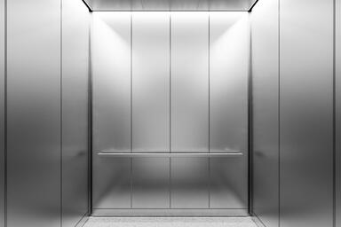 LEVELr-203A Elevator Interior; panels in Stainless Steel with Seastone finish